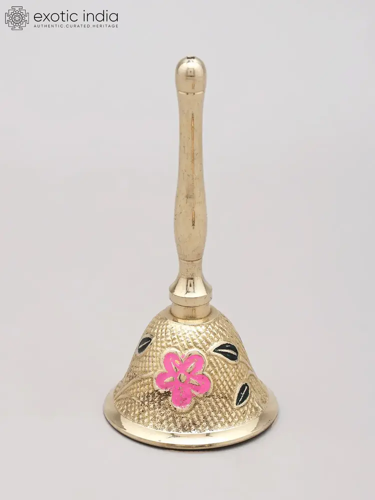 The small brass hand bell with a pink flower