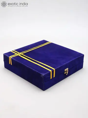 The closed blue velvet box with gold bands