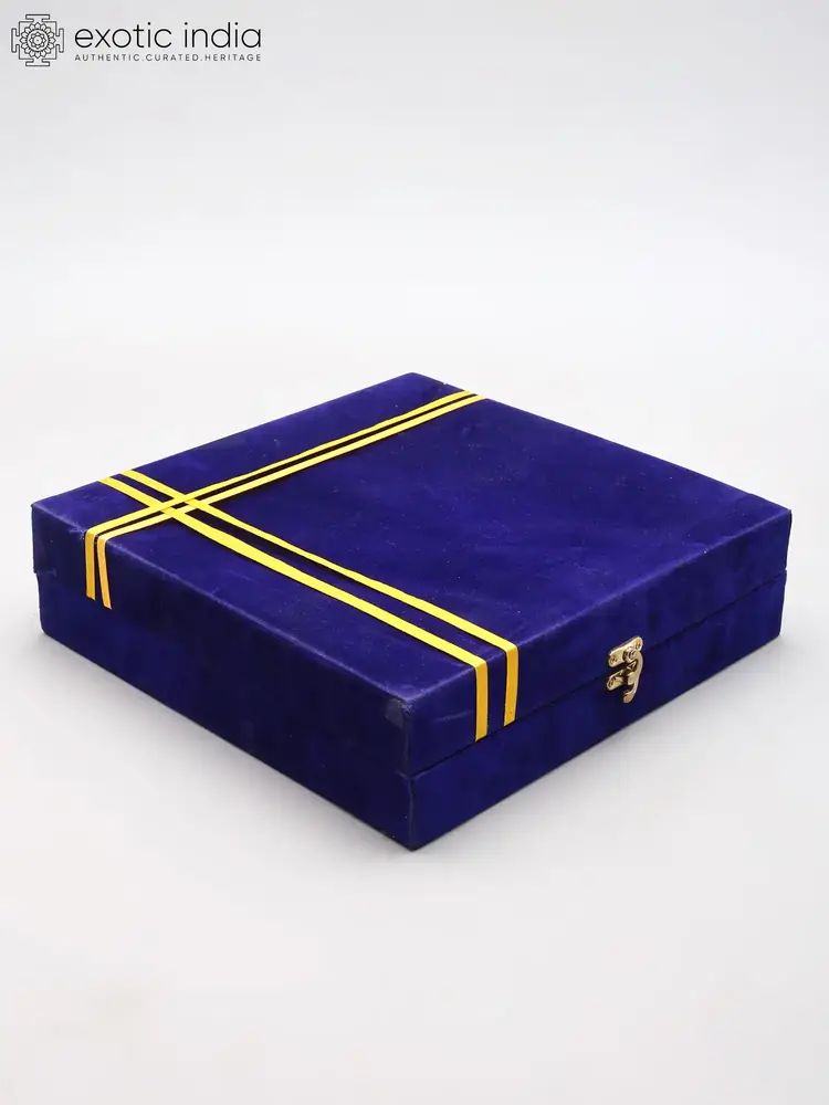 The closed blue velvet box with gold bands