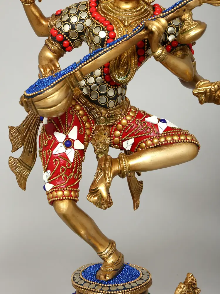 Close view of the inlaid clothes and veena