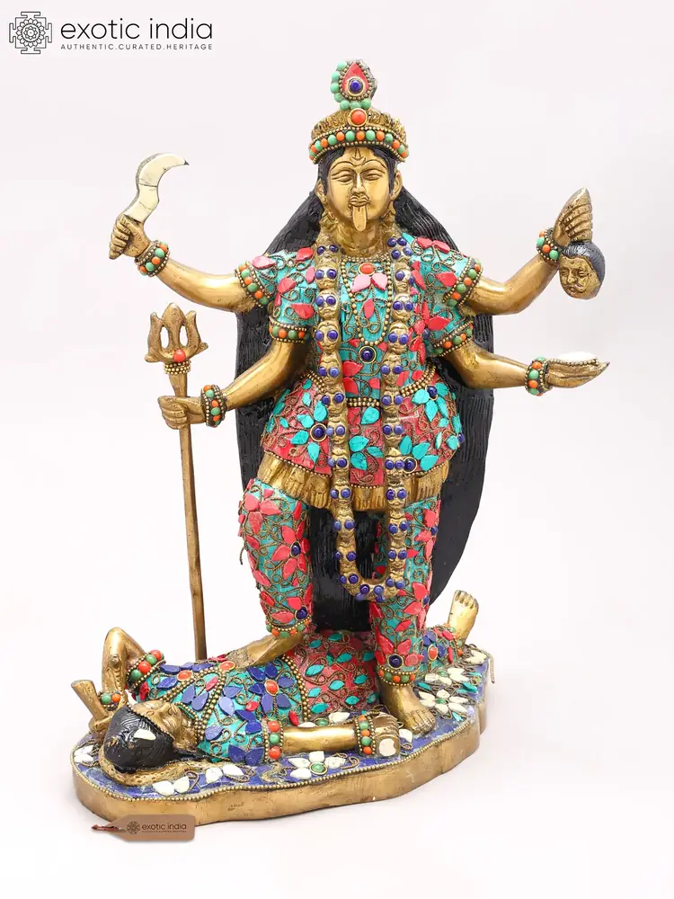Brass Kali with inlay, standing over a reclining figure