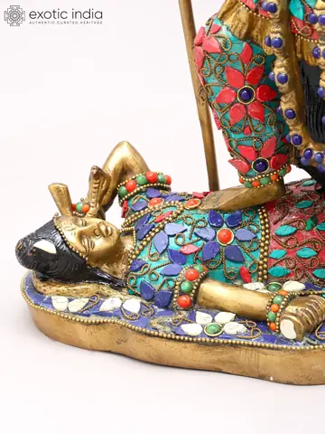 Close view of the base with the reclining figure