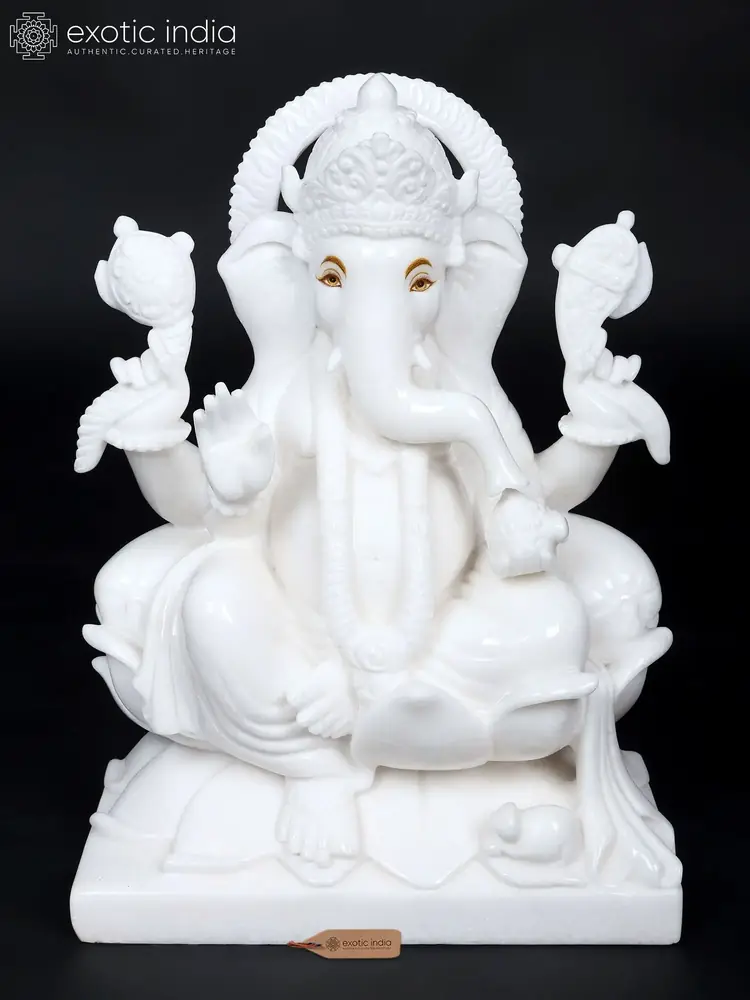 White marble Ganesha seated on a lotus, front view