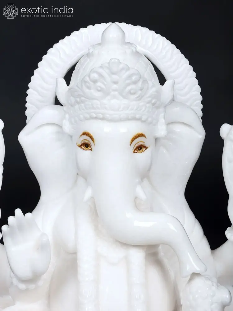 Close view of Ganesha's face, trunk and halo arch