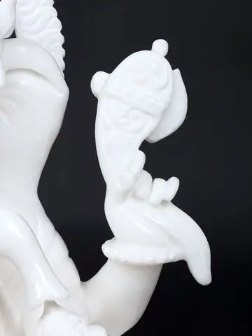 Close view of the lotus base and lower hands