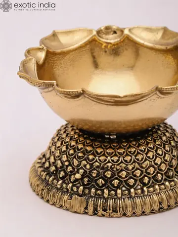 Close view of the diya bowl and beaded base