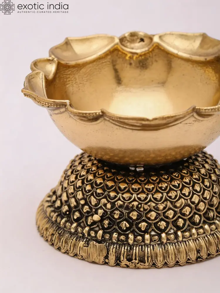 Close view of the diya bowl and beaded base