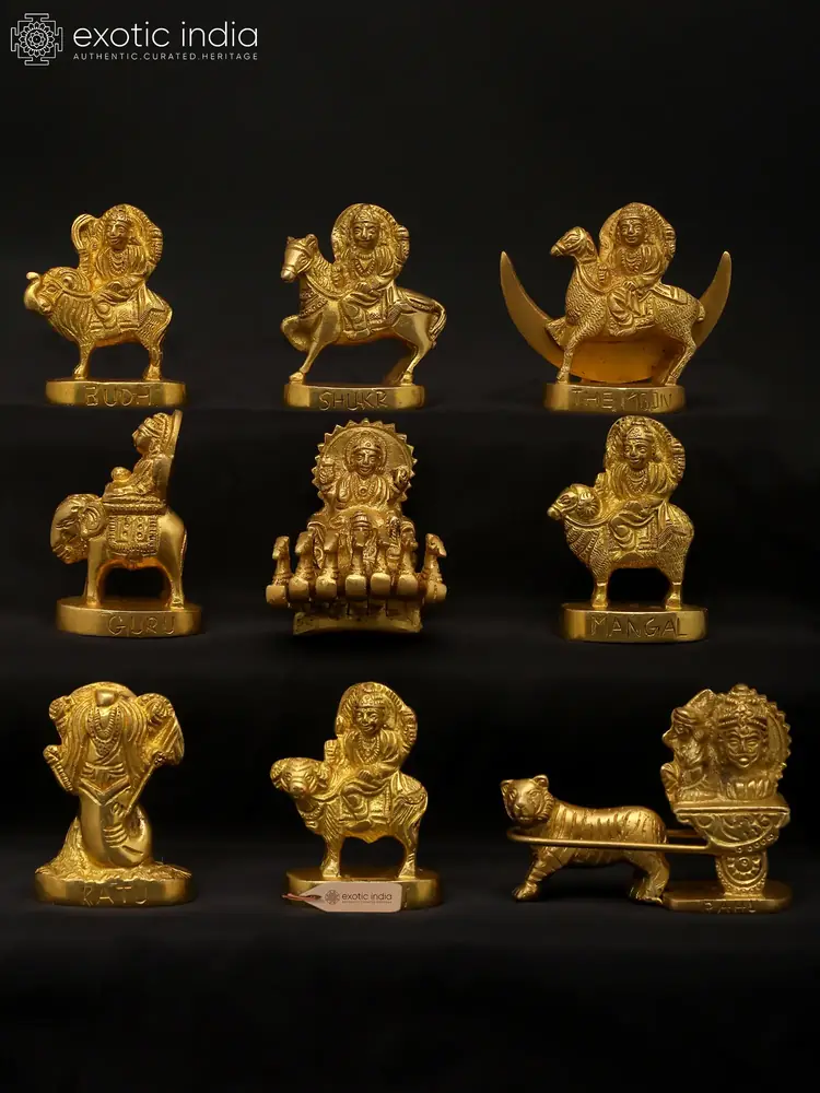 The nine small brass Navagraha figures arranged together