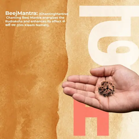 A hand holding the small bead