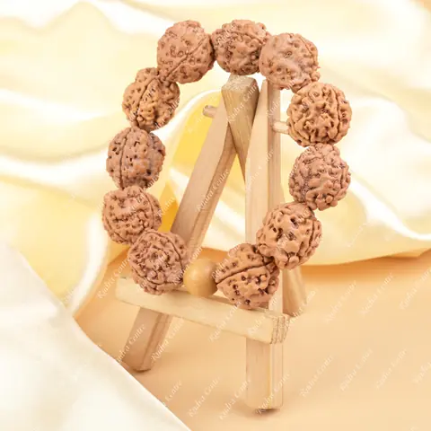 The bracelet standing on a small wooden easel
