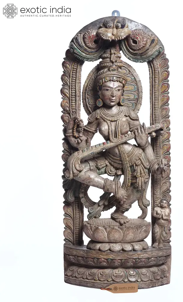Front view of the wooden dancing Saraswati