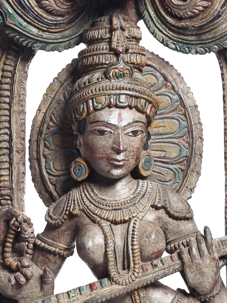 Close view of the face and the veena