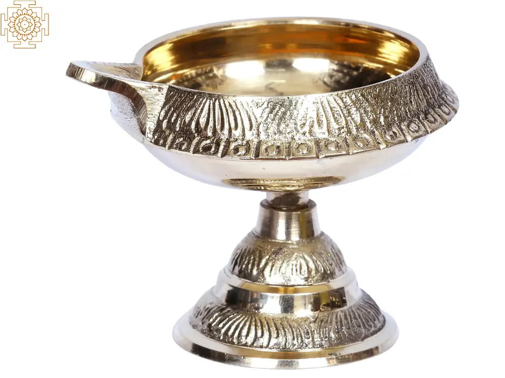 Brass lamp with the wick spout turned to the left