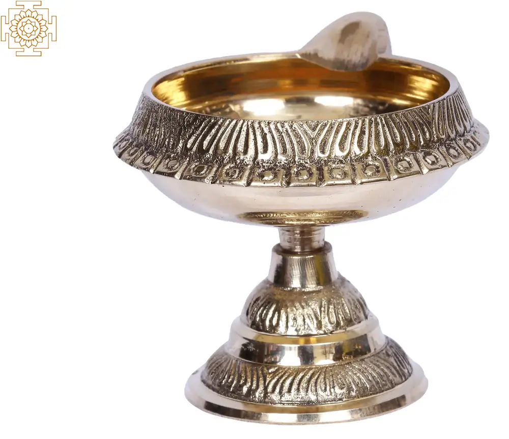 Side view of the footed brass lamp