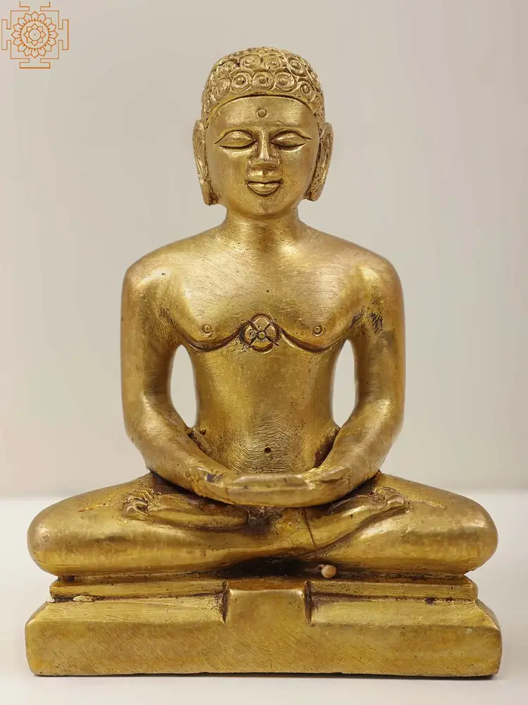 Gold-coloured brass Tirthankara seated in meditation