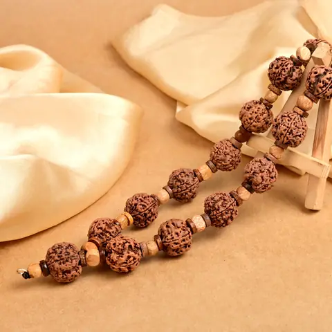 The mala lying along a cloth fold