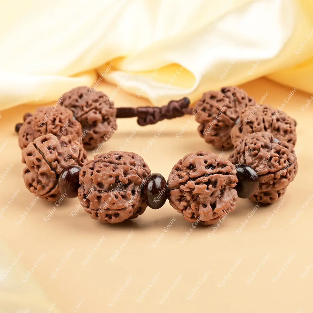 The bracelet on cream cloth showing its thread