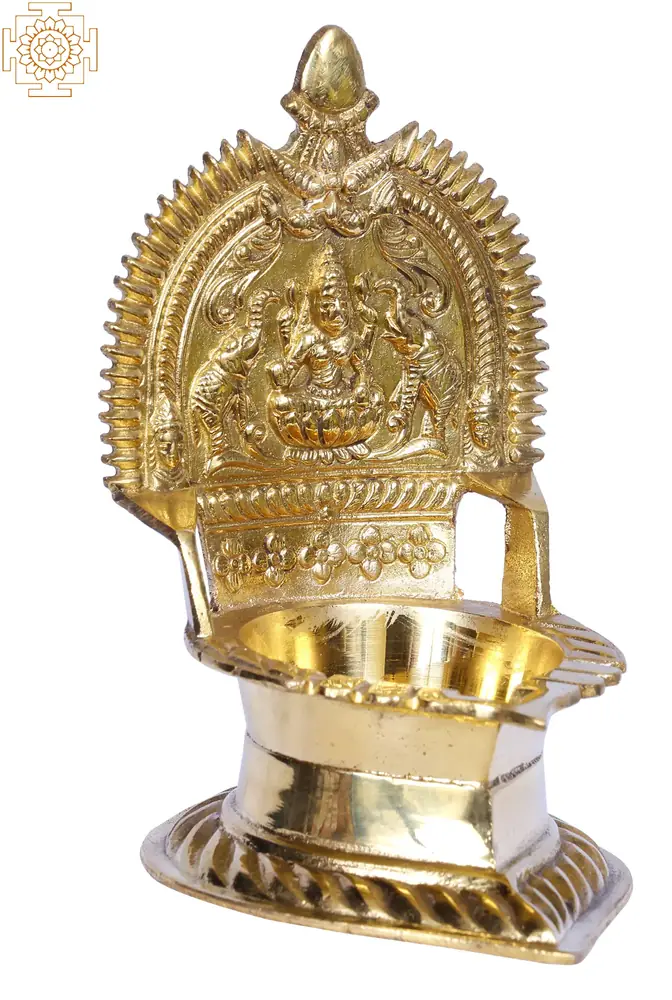 The lamp turned slightly to show the carved back plate
