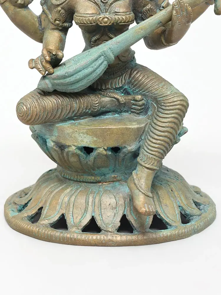 Close view of the lotus seat and veena