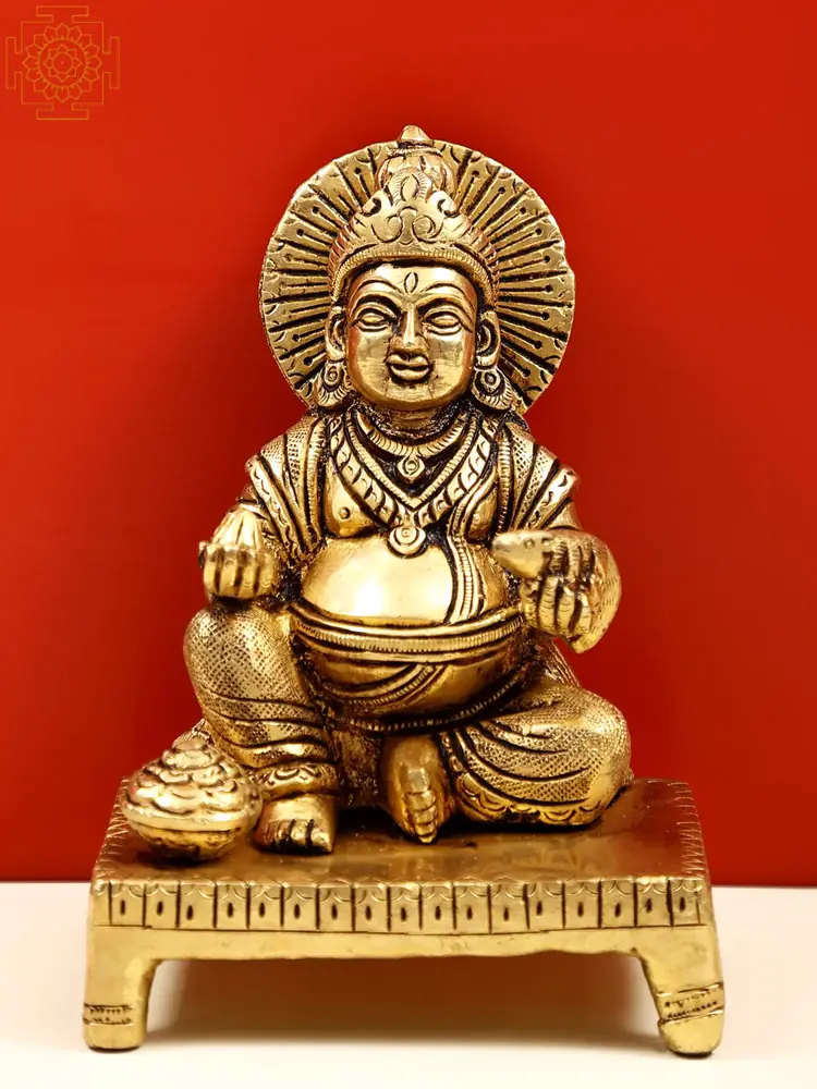 Seated Kubera on a carved platform, front view