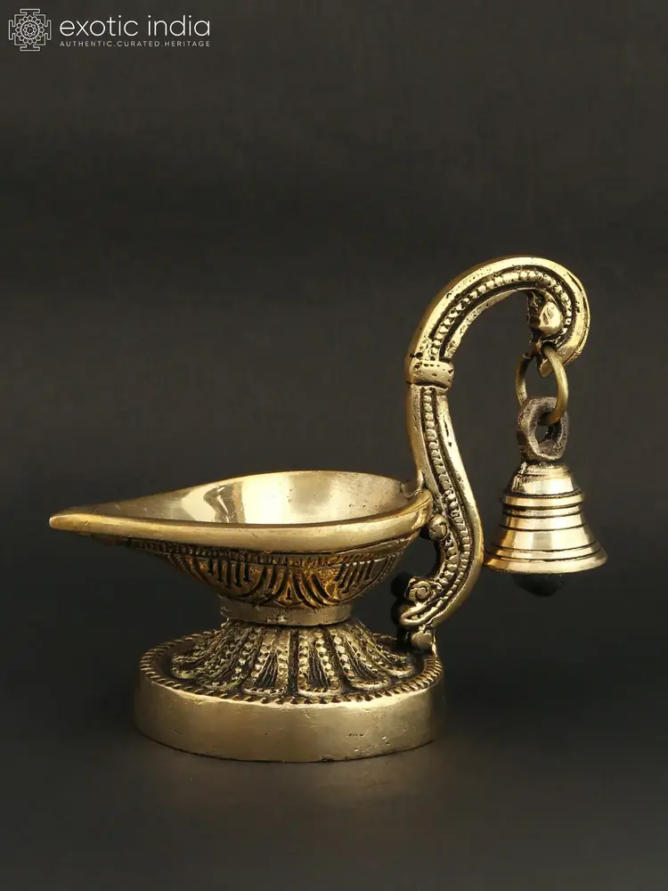 Three quarter view of the lamp and bell