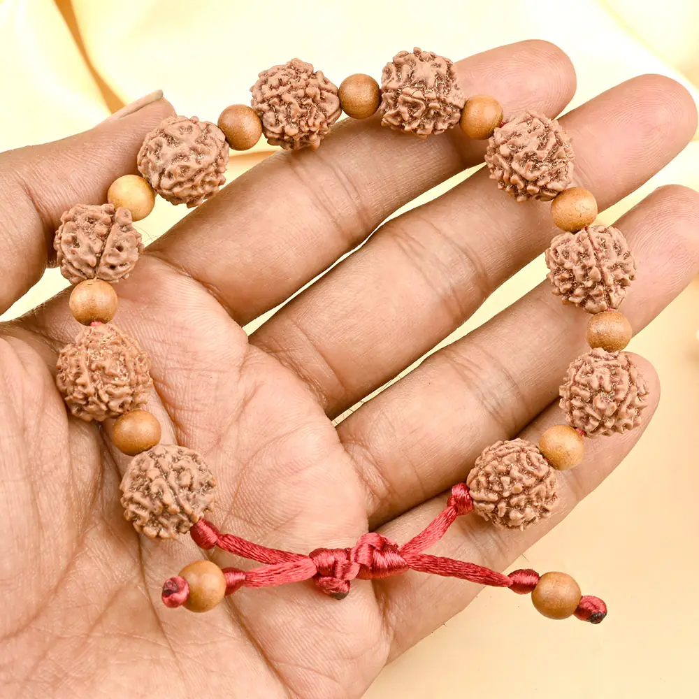 The bracelet held in a hand