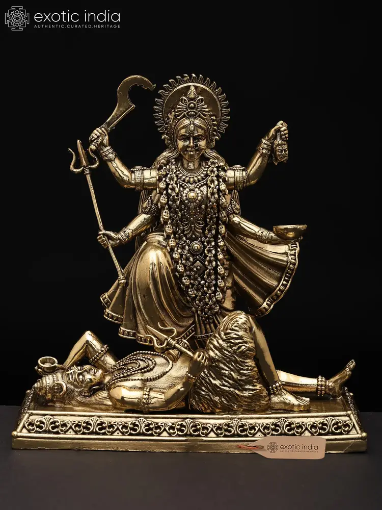 Brass Kali standing on a reclining Shiva, front view