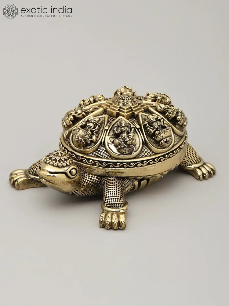 Brass tortoise with a detailed shell on a grey ground