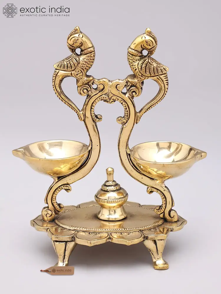 Brass parrot lamp seen from the front