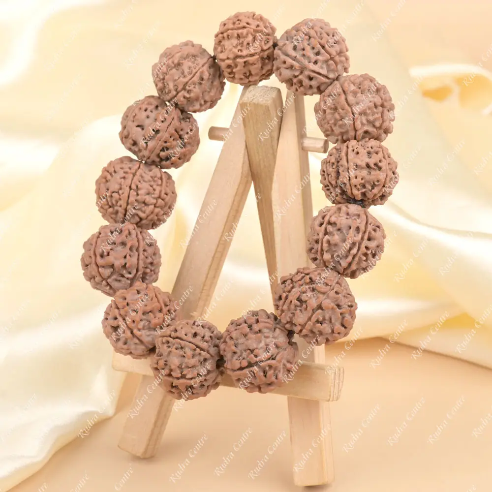 The bracelet propped on a small wooden stand