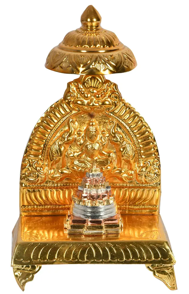 Brass arched shrine with a small Shri Yantra at its base