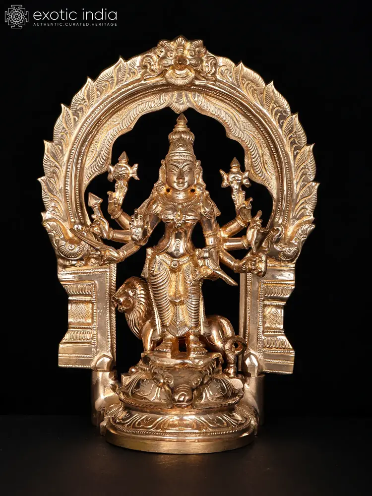 Front view of the bronze Durga with her arch