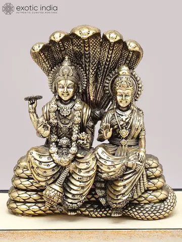 Close view of the two figures and the serpent hoods