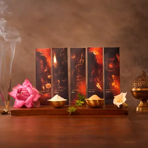 Five slim incense packs standing in a row