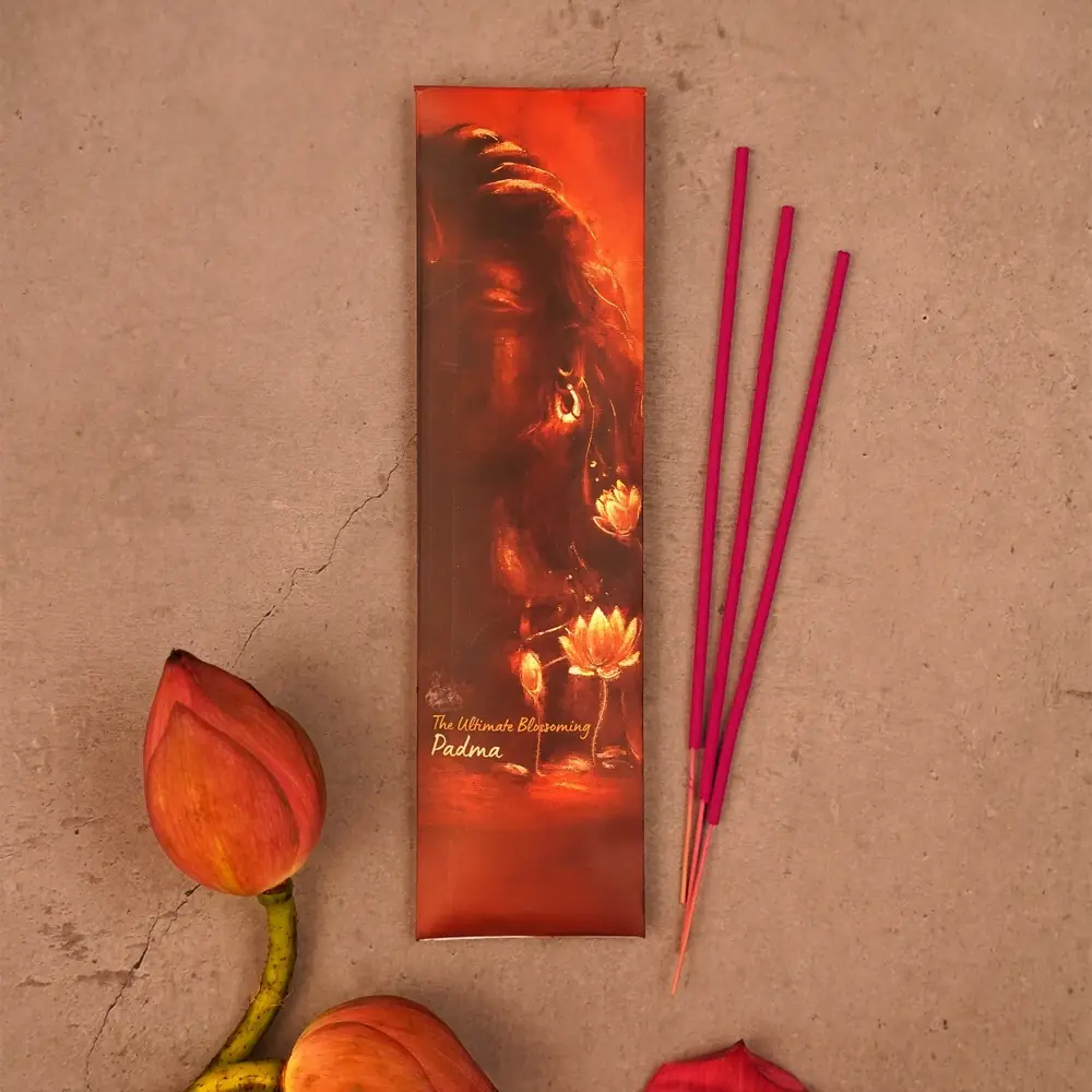 One incense pack with sticks and a lotus flower beside it