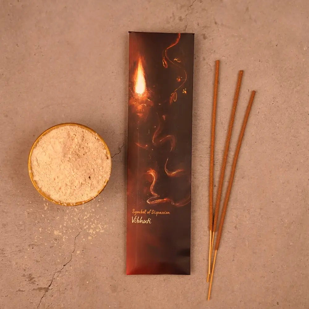 One incense pack with sticks and a small bowl of sandal powder