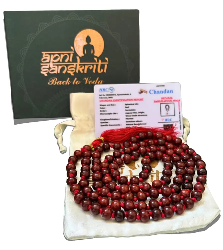 The red sandalwood mala in its pouch with a card