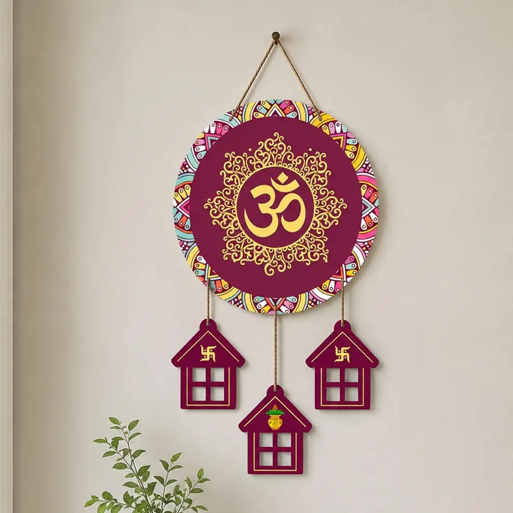The Om plaque with three hanging house shaped panels on a white ground