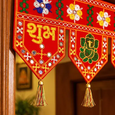 Close view of the Shubh lettering, mirror work and Ganesha panel