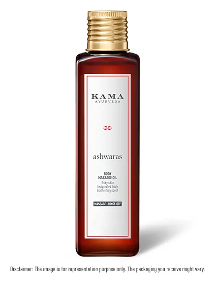 Bottle of Ashwaras body massage oil with a gold cap