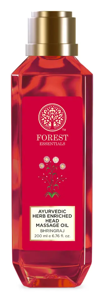 Red bottle of Bhringraj head massage oil with a gold cap