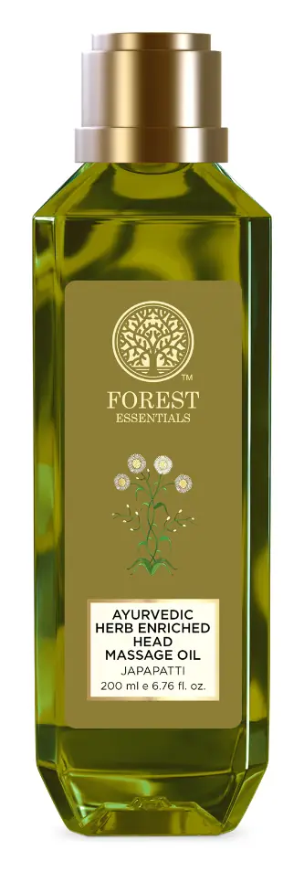 Green bottle of Japapatti head massage oil with a gold cap
