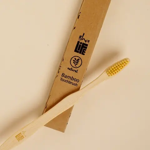 Full length bamboo toothbrush with yellow bristles