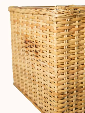 Tall rectangular rattan basket from the side
