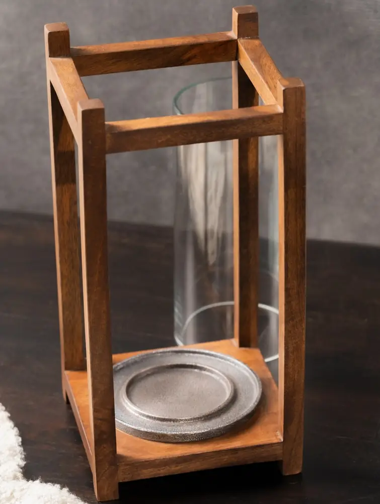 Empty lantern showing the glass cylinder and base tray