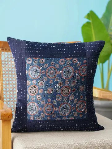The cover on a chair with a plant behind