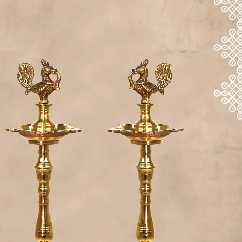 Two brass lamps on a beige background