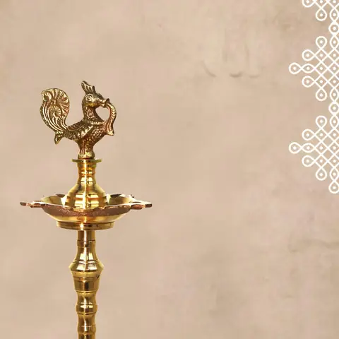 One lamp seen close up with the bird at the top