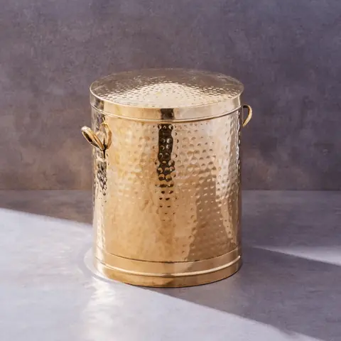 The container filled with flour, lid off