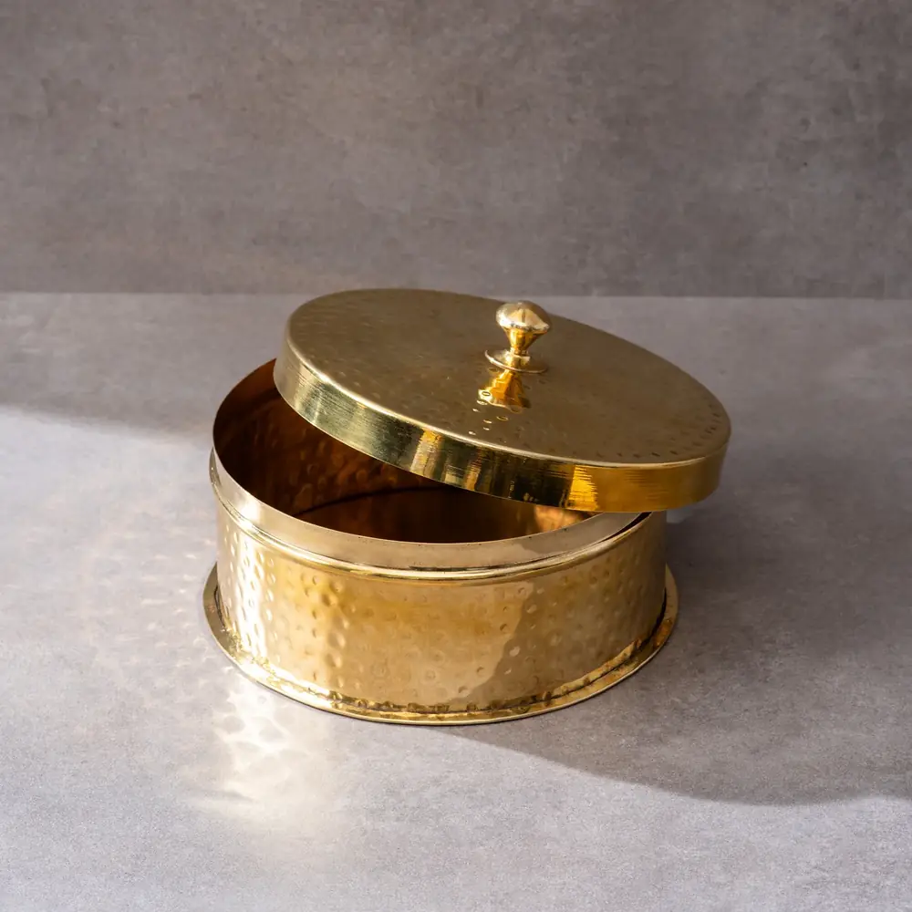 Round hammered brass chapati box with its lid off